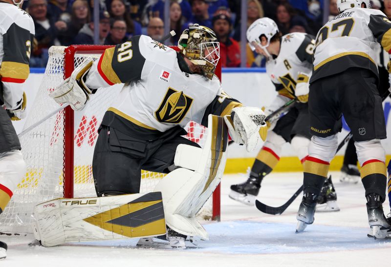 Mar 3, 2026; Buffalo, New York, USA;  Vegas Golden Knights goaltender Akira Schmid (40) tries to get back in position and find the puck during the second period against the Buffalo Sabres at KeyBank Center. Mandatory Credit: Timothy T. Ludwig-Imagn Images