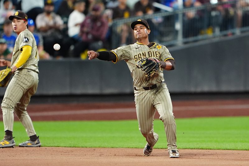 Jun 14, 2024; New York City, New York, USA;  San Diego Padres third baseman Donovan Solano (39) throws out New York Mets first baseman Pete Alonso (not pictured) after fielding a ground ball during the second inning at Citi Field. Mandatory Credit: Gregory Fisher-USA TODAY Sports