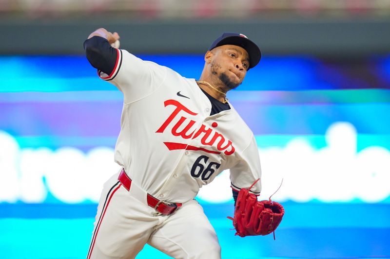 Jun 13, 2024; Minneapolis, Minnesota, USA; Minnesota Twins pitcher Jorge Alcala (66) pitches against the Oakland Athletics in the ninth inning at Target Field. Mandatory Credit: Brad Rempel-USA TODAY Sports