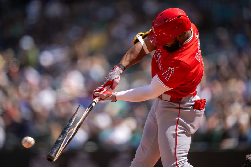 Apr 30, 2025; Seattle, Washington, USA;  Los Angeles Angels third baseman Luis Rengifo (2) breaks his bat during the third inning against the Seattle Mariners at T-Mobile Park. Mandatory Credit: Stephen Brashear-Imagn Images