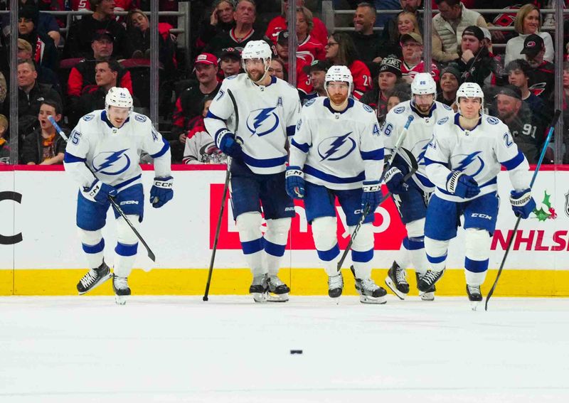 Nov 24, 2023; Raleigh, North Carolina, USA; Tampa Bay Lightning center Brayden Point (21) celebrates his goal against the Carolina Hurricanes during the third period  at PNC Arena. Mandatory Credit: James Guillory-USA TODAY Sports