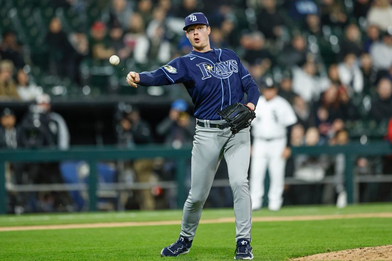 Apr 28, 2023; Chicago, Illinois, USA; Tampa Bay Rays relief pitcher Pete Fairbanks (29) throws to first base for an out against the Chicago White Sox during the ninth inning at Guaranteed Rate Field. Mandatory Credit: Kamil Krzaczynski-USA TODAY Sports