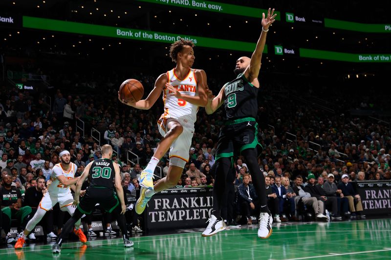 BOSTON, MA - NOVEMBER 12: Dyson Daniels #5 of the Atlanta Hawks passes the ball during the game against the Boston Celtics during the Emirates NBA Cup game on November 12, 2024 at TD Garden in Boston, Massachusetts. NOTE TO USER: User expressly acknowledges and agrees that, by downloading and/or using this Photograph, user is consenting to the terms and conditions of the Getty Images License Agreement. Mandatory Copyright Notice: Copyright 2024 NBAE (Photo by Brian Babineau/NBAE via Getty Images)