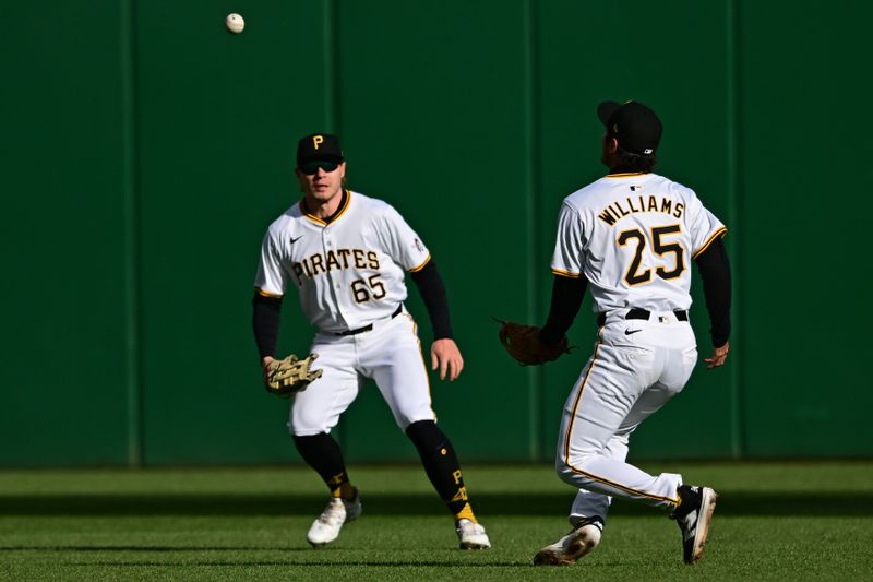 Apr 6, 2024; Pittsburgh, Pennsylvania, USA; Pittsburgh Pirates outfielder Jack Suwinski (65) and second basemen  Alika Williams (25) watch as a ball hit by Baltimore Orioles second base Jorge Mateo (3) falls between them during there sixth inning at PNC Park. Mandatory Credit: David Dermer-USA TODAY Sports