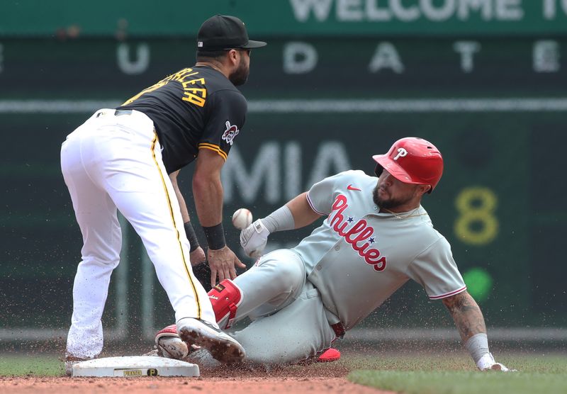Jun 8, 2025; Pittsburgh, Pennsylvania, USA; Philadelphia Phillies catcher Rafael Marchin (13) arrives at second base with a double as Pittsburgh Pirates shortstop Isiah Kiner-Falefa (7) can not field the throw during the third inning at PNC Park. Mandatory Credit: Charles LeClaire-Imagn Images