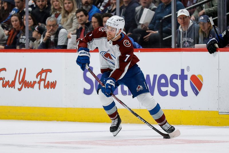 Feb 24, 2024; Denver, Colorado, USA; Colorado Avalanche defenseman Devon Toews (7) controls the puck in the second period against the Toronto Maple Leafs at Ball Arena. Mandatory Credit: Isaiah J. Downing-USA TODAY Sports