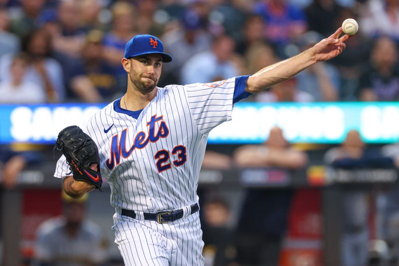 Jun 27, 2023; New York City, New York, USA; New York Mets starting pitcher David Peterson (23) throws the ball to first base for an out during the third inning against the Milwaukee Brewers  at Citi Field. Mandatory Credit: Vincent Carchietta-USA TODAY Sports