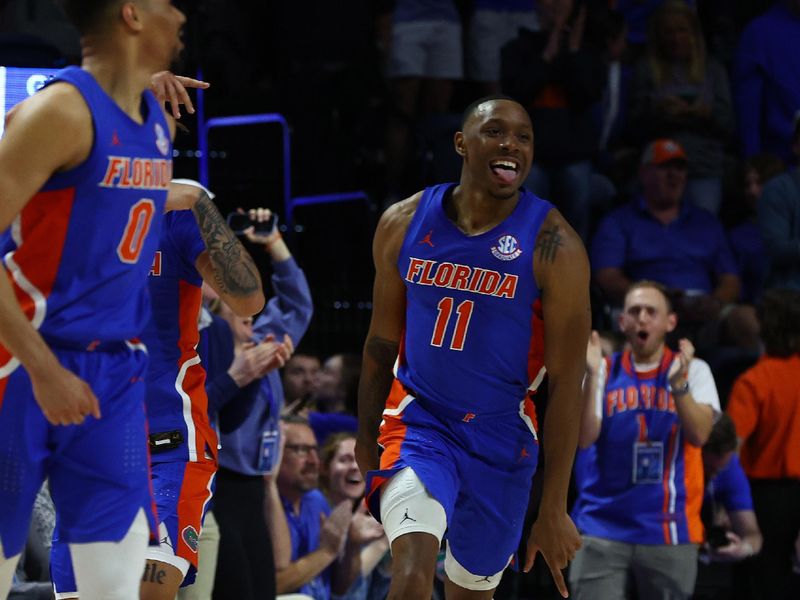 Feb 1, 2023; Gainesville, Florida, USA; Florida Gators guard Kyle Lofton (11) celebrates after a basket against the Tennessee Volunteers during the second half at Exactech Arena at the Stephen C. O'Connell Center. Mandatory Credit: Kim Klement-USA TODAY Sports