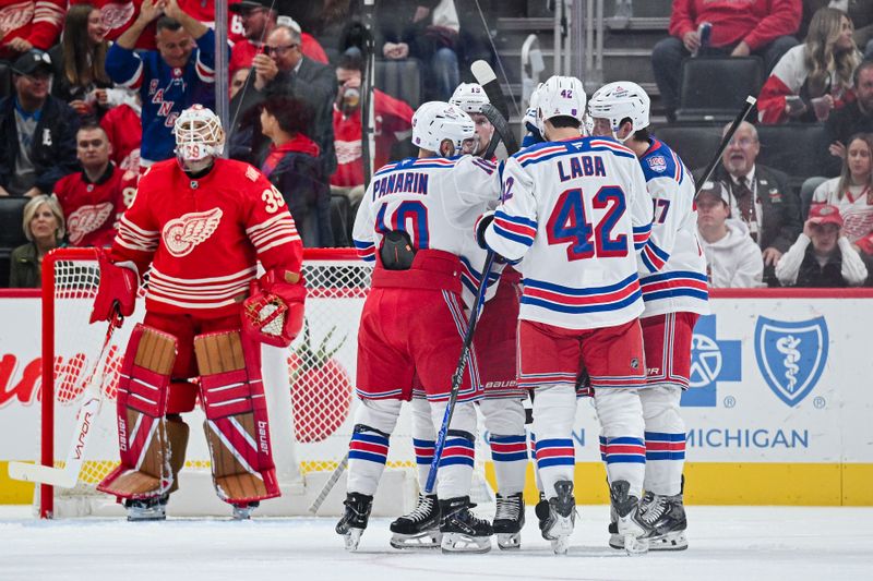 Nov 7, 2025; Detroit, Michigan, USA; New York Rangers center Noah Laba (42) celebrates his goal with teammates during the second period against the Detroit Red Wings at Little Caesars Arena. Mandatory Credit: Tim Fuller-Imagn Images