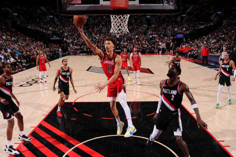 PORTLAND, OR - APRIL 9: Dyson Daniels #11 of the New Orleans Pelicans drives to the basket during the game against the Portland Trail Blazers on April 9, 2024 at the Moda Center Arena in Portland, Oregon. NOTE TO USER: User expressly acknowledges and agrees that, by downloading and or using this photograph, user is consenting to the terms and conditions of the Getty Images License Agreement. Mandatory Copyright Notice: Copyright 2024 NBAE (Photo by Cameron Browne/NBAE via Getty Images)