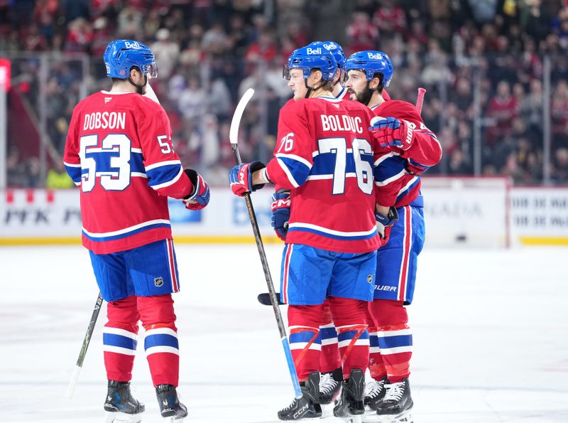 Jan 27, 2026; Montreal, Quebec, CAN; Montreal Canadiens forward Philip Danault (24) celebrates with teammates after scoring a goal against the Vegas Golden Knights during the second period at the Bell Centre. Mandatory Credit: Eric Bolte-Imagn Images