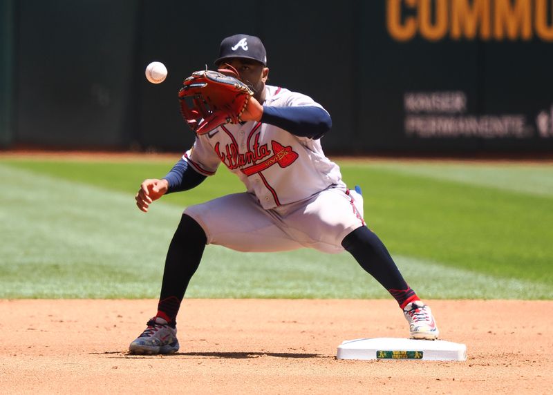 May 31, 2023; Oakland, California, USA; Atlanta Braves second baseman Ozzie Albies (1) receives the ball to make the first out of a double play against the Oakland Athletics during the fourth inning at Oakland-Alameda County Coliseum. Mandatory Credit: Kelley L Cox-USA TODAY Sports