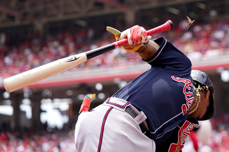 Jun 25, 2023; Cincinnati, Ohio, USA; Atlanta Braves right fielder Ronald Acuna Jr. (13) avoids an insect while warming up in the on-deck circle prior to the first inning of a baseball game against the Cincinnati Reds at Great American Ball Park. The Atlanta Braves won, 7-6. Mandatory Credit: Kareem Elgazzar-USA TODAY Sports