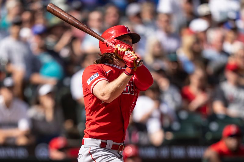 Sep 13, 2023; Seattle, Washington, USA; Los Angeles Angels right fielder Brett Phillips (4) hits a solo home run during the third inning against the Seattle Mariners at T-Mobile Park. Mandatory Credit: Stephen Brashear-USA TODAY Sports