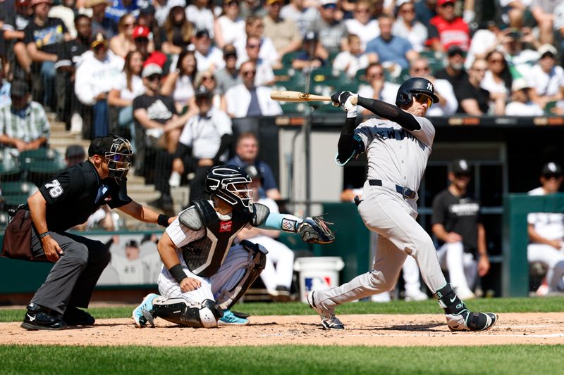 Aug 31, 2025; Chicago, Illinois, USA; New York Yankees outfielder Cody Bellinger (35) hits an RBI-double against the Chicago White Sox during the third inning at Rate Field. Mandatory Credit: Kamil Krzaczynski-Imagn Images
