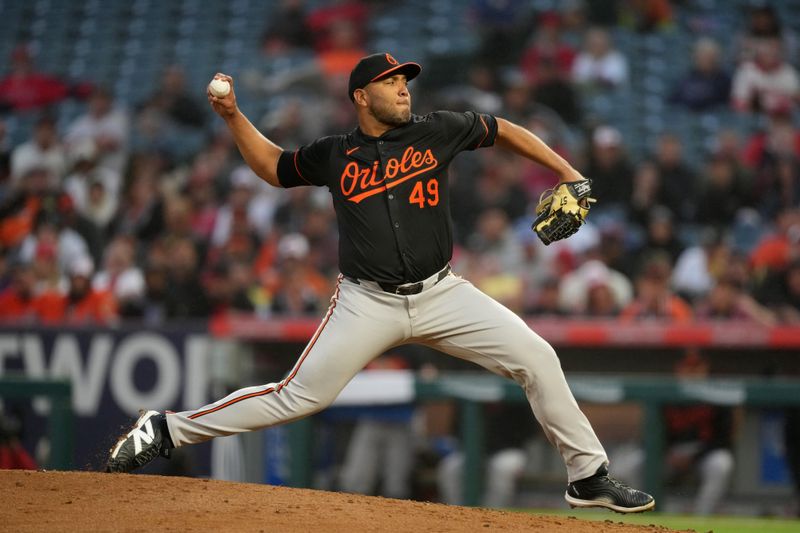 Apr 22, 2024; Anaheim, California, USA; Baltimore Orioles pitcher Albert Suarez (49) throws in the second inning against the Los Angeles Angels at Angel Stadium. Mandatory Credit: Kirby Lee-USA TODAY Sports