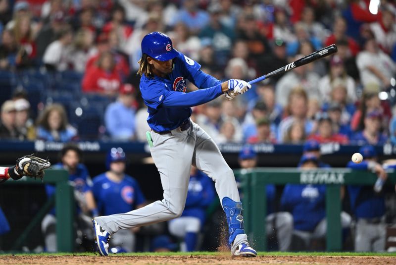 Sep 25, 2024; Philadelphia, Pennsylvania, USA; Chicago Cubs outfielder Kevin Alcantara (13) hits an infield single against the Philadelphia Phillies in the ninth inning at Citizens Bank Park. Mandatory Credit: Kyle Ross-Imagn Images