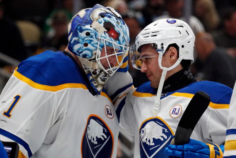 Jan 6, 2024; Pittsburgh, Pennsylvania, USA;  Buffalo Sabres goaltender Ukko-Pekka Luukkonen (1) and defenseman Connor Clifton (right) celebrate after defeating the Pittsburgh Penguins at PPG Paints Arena. Buffalo won 3-1. Mandatory Credit: Charles LeClaire-USA TODAY Sports