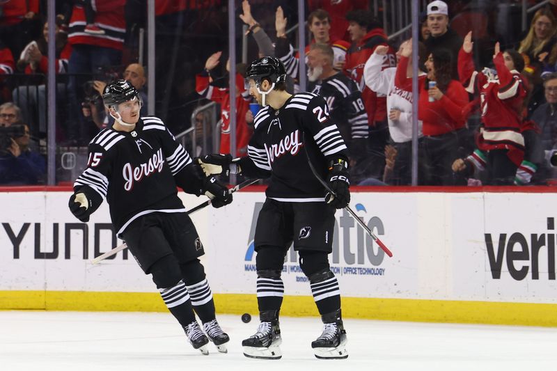 Jan 6, 2024; Newark, New Jersey, USA; New Jersey Devils defenseman Colin Miller (24) celebrates his goal against the Vancouver Canucks during the third period at Prudential Center. Mandatory Credit: Ed Mulholland-USA TODAY Sports