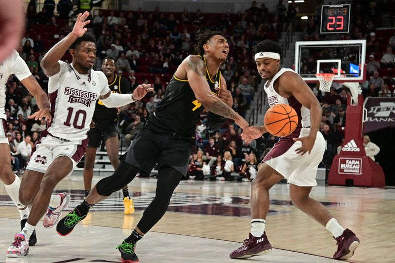 Feb 4, 2023; Starkville, Mississippi, USA; Missouri Tigers guard DeAndre Gholston (4) loses control of the ball to Mississippi State Bulldogs guard Eric Reed Jr. (11) during the first half  at Humphrey Coliseum. Mandatory Credit: Matt Bush-USA TODAY Sports