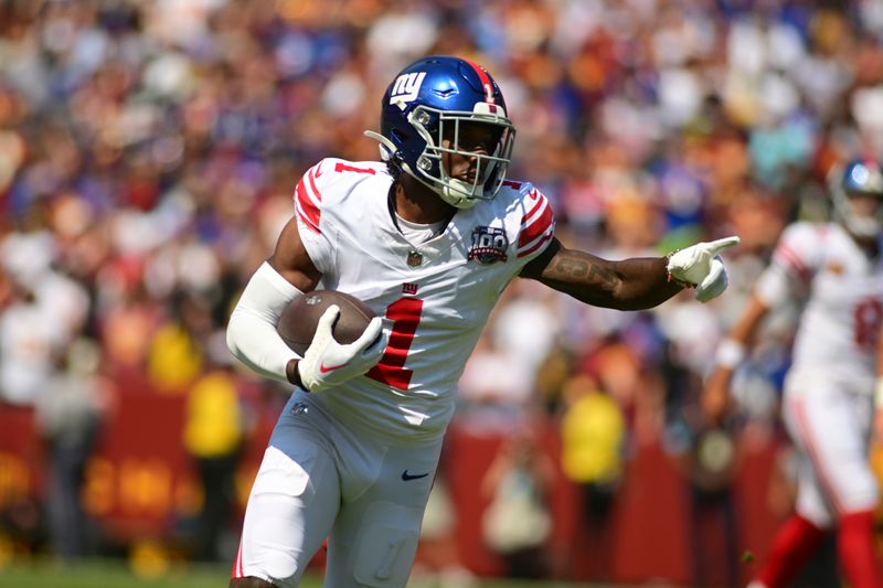 New York Giants wide receiver Malik Nabers (1) runs after a catch against the Washington Commanders during the first half of an NFL football game in Landover, Md., Sunday, Sept. 15, 2024. (AP Photo/Steve Ruark)