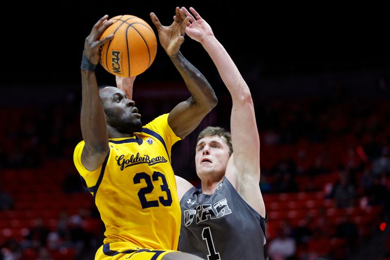 Feb 5, 2023; Salt Lake City, Utah, USA; California Golden Bears forward Obinna Anyanwu (23) drives against Utah Utes forward Ben Carlson (1) in the first half at Jon M. Huntsman Center. Mandatory Credit: Jeffrey Swinger-USA TODAY Sports