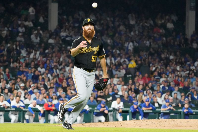 Sep 21, 2023; Chicago, Illinois, USA; Pittsburgh Pirates relief pitcher Colin Selby (52) throws out Chicago Cubs second baseman Nico Hoerner (not pictured) during the seventh inning at Wrigley Field. Mandatory Credit: David Banks-USA TODAY Sports