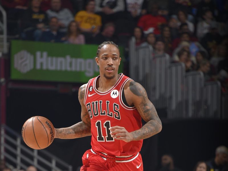 CLEVELAND, OH - FEBRUARY 11: DeMar DeRozan #11 of the Chicago Bulls dribbles the ball during the game against the Cleveland Cavaliers  on February 11, 2023 at Rocket Mortgage FieldHouse in Cleveland, Ohio. NOTE TO USER: User expressly acknowledges and agrees that, by downloading and/or using this Photograph, user is consenting to the terms and conditions of the Getty Images License Agreement. Mandatory Copyright Notice: Copyright 2023 NBAE (Photo by David Liam Kyle/NBAE via Getty Images)