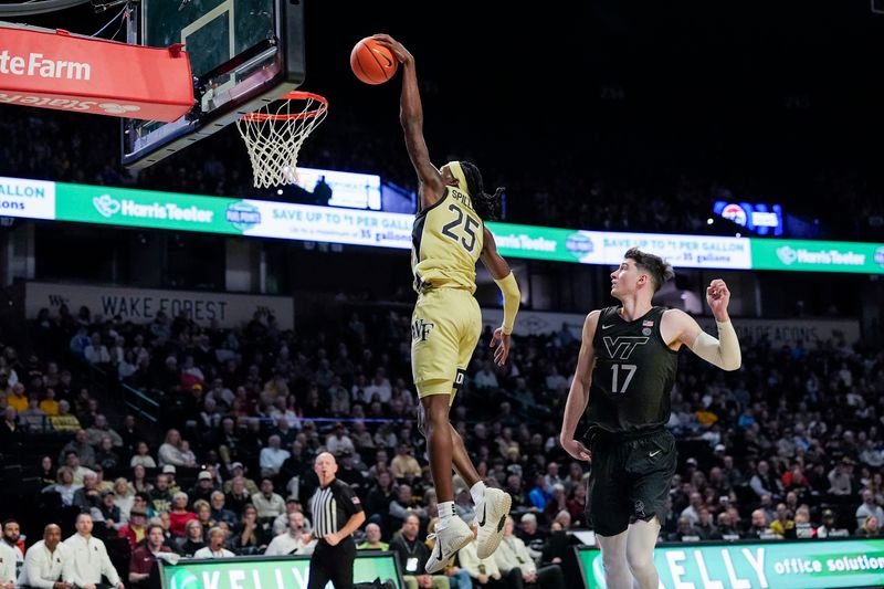 Jan 3, 2026; Winston-Salem, North Carolina, USA;  Wake Forest Demon Deacons forward Tre'Von Spillers (25) goes up for a slam dunk defended by Virginia Tech Hokies guard Neoklis Avdalas (17) during the first half at Lawrence Joel Veterans Memorial Coliseum. Mandatory Credit: Jim Dedmon-Imagn Images