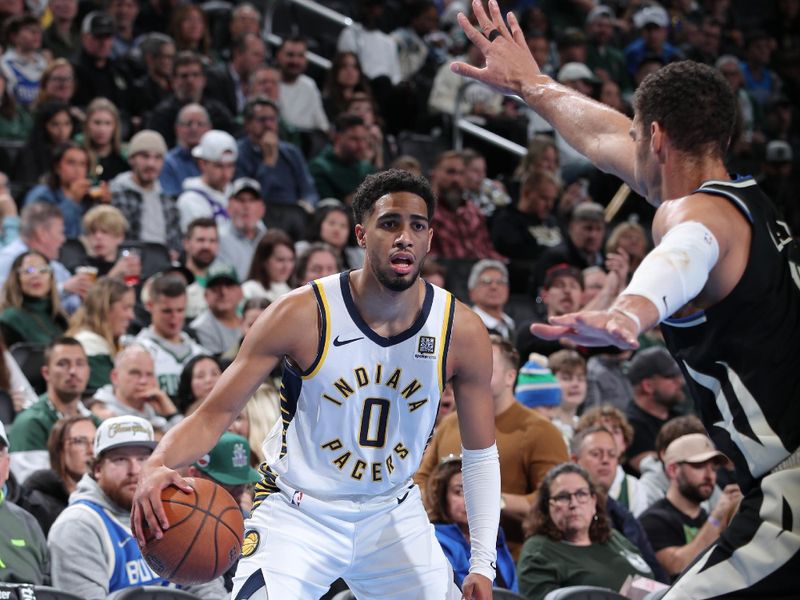 MILWAUKEE, WI - NOVEMBER 22: Tyrese Haliburton #0 of the Indiana Pacers dribbles the ball during the game against the Milwaukee Bucks  during a Emirates NBA Cup on November 22, 2024 at Fiserv Forum Center in Milwaukee, Wisconsin. NOTE TO USER: User expressly acknowledges and agrees that, by downloading and or using this Photograph, user is consenting to the terms and conditions of the Getty Images License Agreement. Mandatory Copyright Notice: Copyright 2024 NBAE (Photo by Gary Dineen/NBAE via Getty Images).