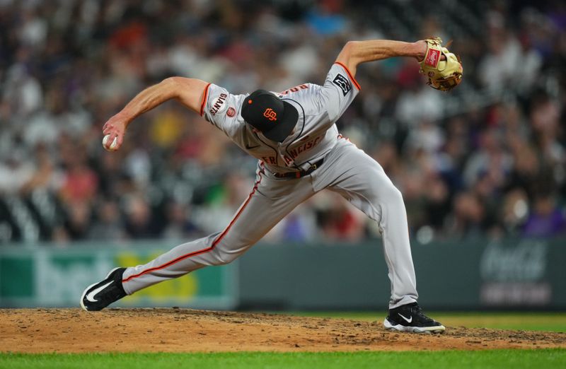 Jul 19, 2024; Denver, Colorado, USA; San Francisco Giants relief pitcher Tyler Rogers (71) delivers a pitch in the eighth inning against the Colorado Rockies at Coors Field. Mandatory Credit: Ron Chenoy-USA TODAY Sports