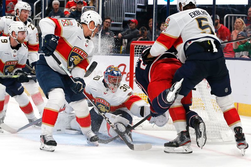 Oct 15, 2024; Columbus, Ohio, USA; Columbus Blue Jackets center Sean Monahan (23) scores on the rebound of a Florida Panthers goalie Spencer Knight (30) save during the second period at Nationwide Arena. Mandatory Credit: Russell LaBounty-Imagn Images