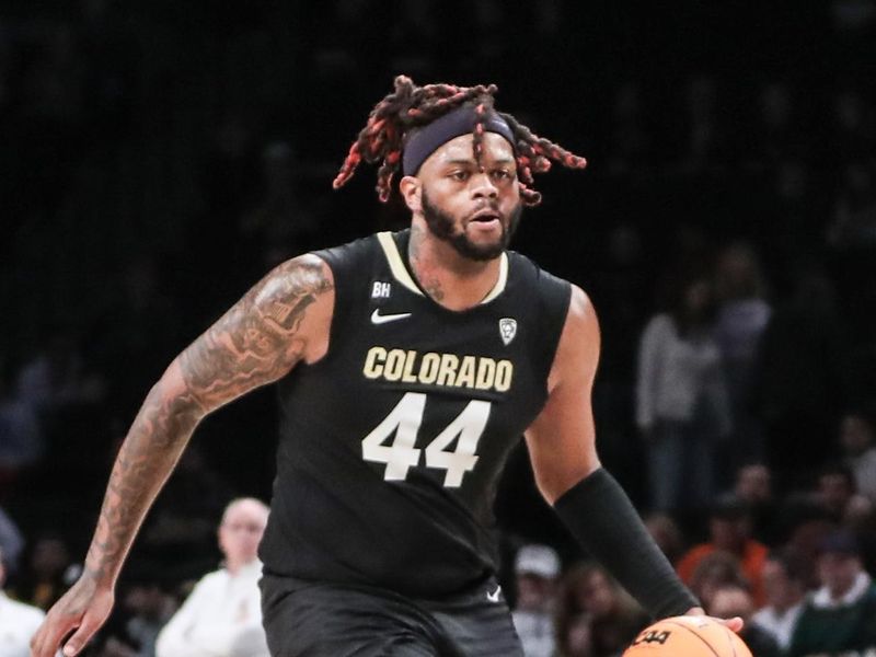 Dec 10, 2023; Brooklyn, New York, USA; Colorado Buffaloes center Eddie Lampkin Jr. (44) brings the ball up court in the second half against the Miami (Fl) Hurricanes at Barclays Center. Mandatory Credit: Wendell Cruz-USA TODAY Sports