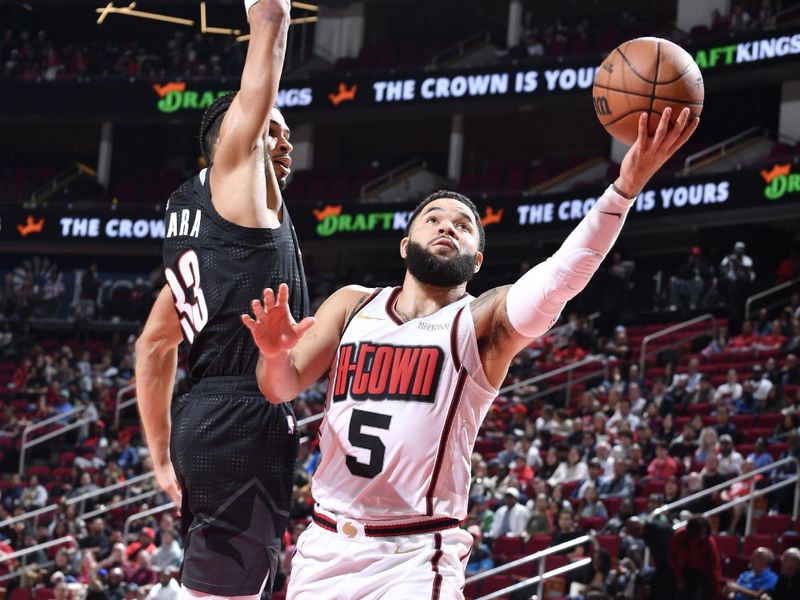 HOUSTON, TX -NOVEMBER 23:  Fred VanVleet #5 of the Houston Rockets drives to the basket during the game against the Portland Trail Blazers on November 23, 2024 at the Toyota Center in Houston, Texas. NOTE TO USER: User expressly acknowledges and agrees that, by downloading and or using this photograph, User is consenting to the terms and conditions of the Getty Images License Agreement. Mandatory Copyright Notice: Copyright 2024 NBAE (Photo by Logan Riely/NBAE via Getty Images)