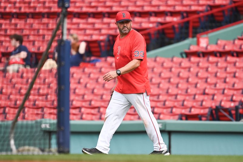 Aug 9, 2024; Boston, Massachusetts, USA; Boston Red Sox game planning coordinator/catching coach Jason Varitek (33) walks to the outfield before a game against the Houston Astros at Fenway Park. Mandatory Credit: Eric Canha-USA TODAY Sports