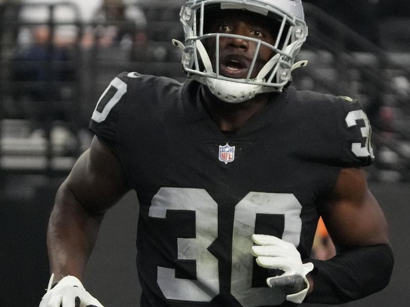 Las Vegas Raiders safety Duron Harmon (30) intercepts the ball during an NFL football game against the Houston Texans, Sunday, Oct 23, 2022, in Las Vegas. (AP Photo/Rick Scuteri)