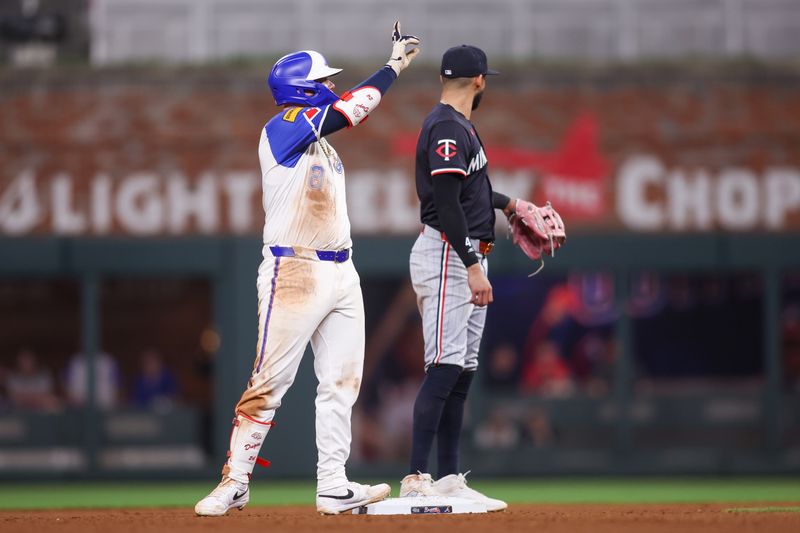 Apr 19, 2025; Atlanta, Georgia, USA; Atlanta Braves left fielder Alex Verdugo (8) reacts after a double against the Minnesota Twins in the eighth inning at Truist Park. Mandatory Credit: Brett Davis-Imagn Images