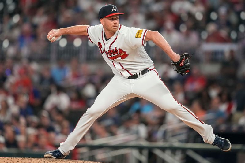 Aug 23, 2023; Cumberland, Georgia, USA; Atlanta Braves relief pitcher Michael Tonkin (51) pitches against the New York Mets during the eighth inning at Truist Park. Mandatory Credit: Dale Zanine-USA TODAY Sports