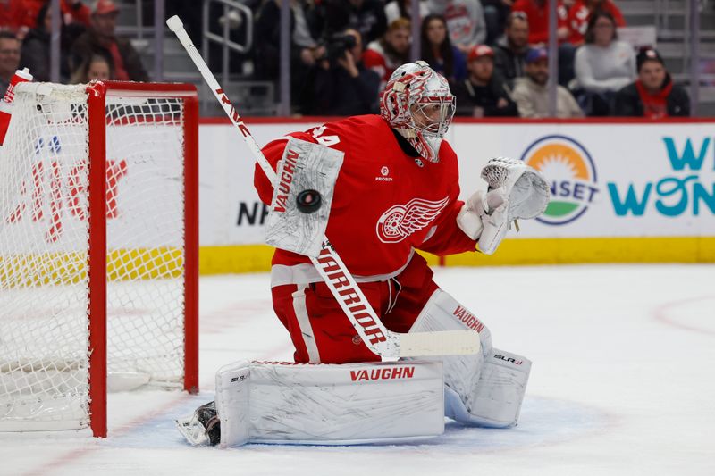 Feb 29, 2024; Detroit, Michigan, USA;  Detroit Red Wings goaltender Alex Lyon (34) makes a save in the first period against the New York Islanders at Little Caesars Arena. Mandatory Credit: Rick Osentoski-USA TODAY Sports