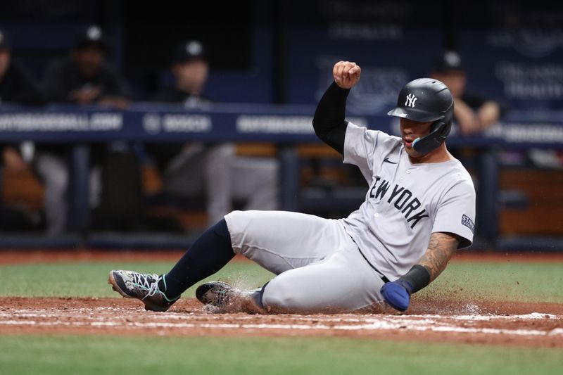 Jul 10, 2024; St. Petersburg, Florida, USA;  New York Yankees second baseman Gleyber Torres (25) scores a run against the Tampa Bay Rays in the fourth inning at Tropicana Field. Mandatory Credit: Nathan Ray Seebeck-USA TODAY Sports