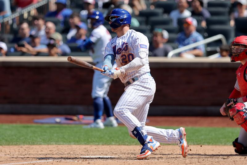 Aug 27, 2023; New York City, New York, USA; New York Mets first baseman Pete Alonso (20) follows through on an RBI double against the Los Angeles Angels during the eighth inning at Citi Field. Mandatory Credit: Brad Penner-USA TODAY Sports