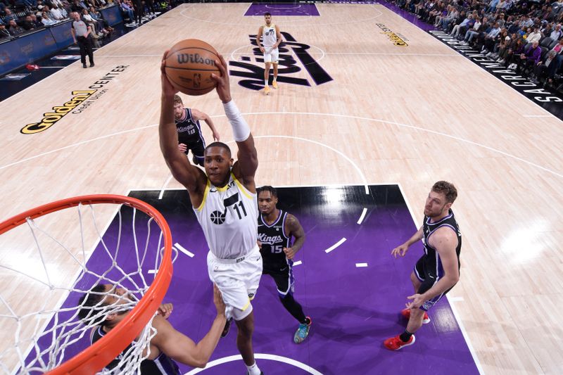 SACRAMENTO, CA - MARCH 31: Kris Dunn #11 of the Utah Jazz drives to the basket during the game against the Sacramento Kings on March 31, 2024 at Golden 1 Center in Sacramento, California. NOTE TO USER: User expressly acknowledges and agrees that, by downloading and or using this Photograph, user is consenting to the terms and conditions of the Getty Images License Agreement. Mandatory Copyright Notice: Copyright 2024 NBAE (Photo by Rocky Widner/NBAE via Getty Images)