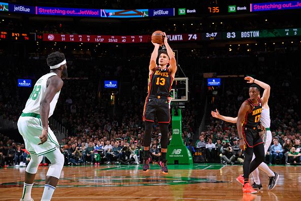 BOSTON, MA - November 26: Bogdan Bogdanovic #13 of the Atlanta Hawks shoots a three point basket during the game against the Boston Celtics on November 26, 2023 at the TD Garden in Boston, Massachusetts. NOTE TO USER: User expressly acknowledges and agrees that, by downloading and or using this photograph, User is consenting to the terms and conditions of the Getty Images License Agreement. Mandatory Copyright Notice: Copyright 2023 NBAE  (Photo by Brian Babineau/NBAE via Getty Images)