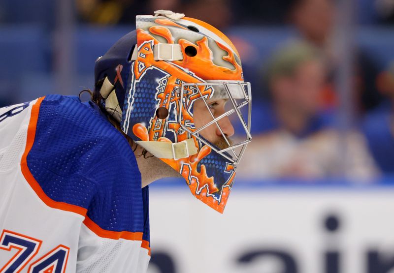 Mar 9, 2024; Buffalo, New York, USA;  Edmonton Oilers goaltender Stuart Skinner (74) looks for the puck during the second period against the Buffalo Sabres at KeyBank Center. Mandatory Credit: Timothy T. Ludwig-USA TODAY Sports