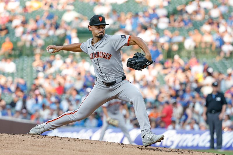 Jun 17, 2024; Chicago, Illinois, USA; San Francisco Giants starting pitcher Jordan Hicks (12) delivers a pitch against the Chicago Cubs during the first inning at Wrigley Field. Mandatory Credit: Kamil Krzaczynski-USA TODAY Sports