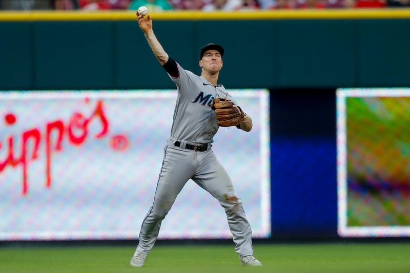 Aug 8, 2023; Cincinnati, Ohio, USA; Miami Marlins shortstop Joey Wendle (18) throws to first to get Cincinnati Reds left fielder Spencer Steer (not pictured) out in the sixth inning at Great American Ball Park. Mandatory Credit: Katie Stratman-USA TODAY Sports