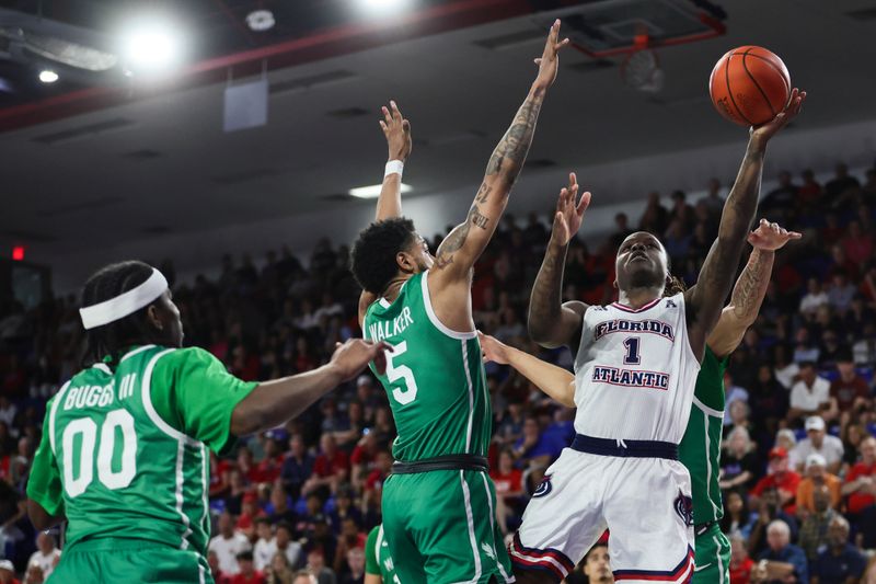 Jan 28, 2024; Boca Raton, Florida, USA; Florida Atlantic Owls guard Johnell Davis (1) drives to the basket against North Texas Mean Green guard Rondel Walker (5) during the second half at Eleanor R. Baldwin Arena. Mandatory Credit: Sam Navarro-USA TODAY Sports