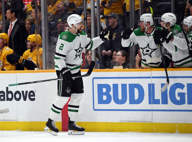 Dec 23, 2023; Nashville, Tennessee, USA; Dallas Stars defenseman Jani Hakanpaa (2) celebrates with teammates after scoring the game-winning goal late in the third period to beat the Nashville Predators at Bridgestone Arena. Mandatory Credit: Christopher Hanewinckel-USA TODAY Sports