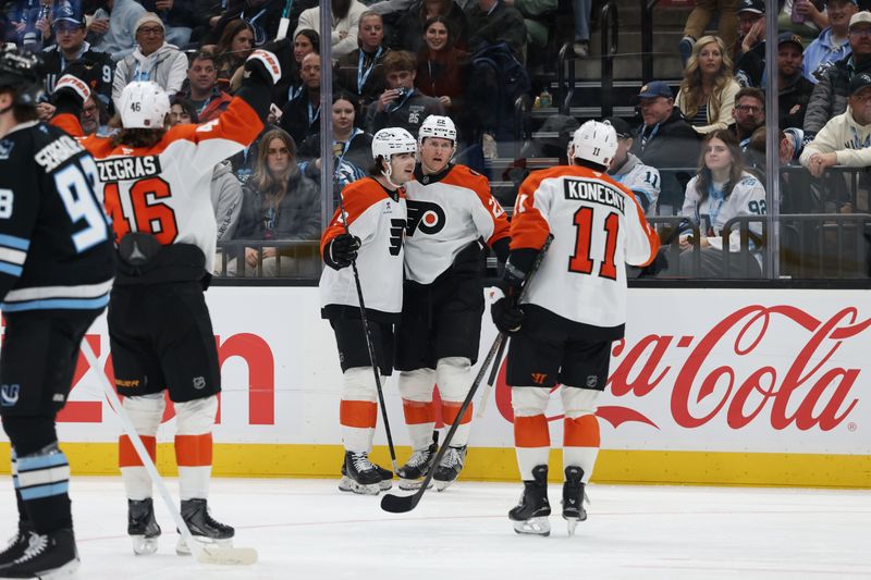 Jan 21, 2026; Salt Lake City, Utah, USA; The Philadelphia Flyers celebrate a goal by center Christian Dvorak (22) during the second period at Delta Center. Mandatory Credit: Rob Gray-Imagn Images