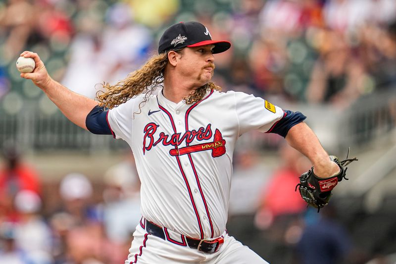 Jun 5, 2025; Cumberland, Georgia, USA; Atlanta Braves starting pitcher Grant Holmes (66) pitches against the Arizona Diamondbacks during the first inning at Truist Park. Mandatory Credit: Dale Zanine-Imagn Images